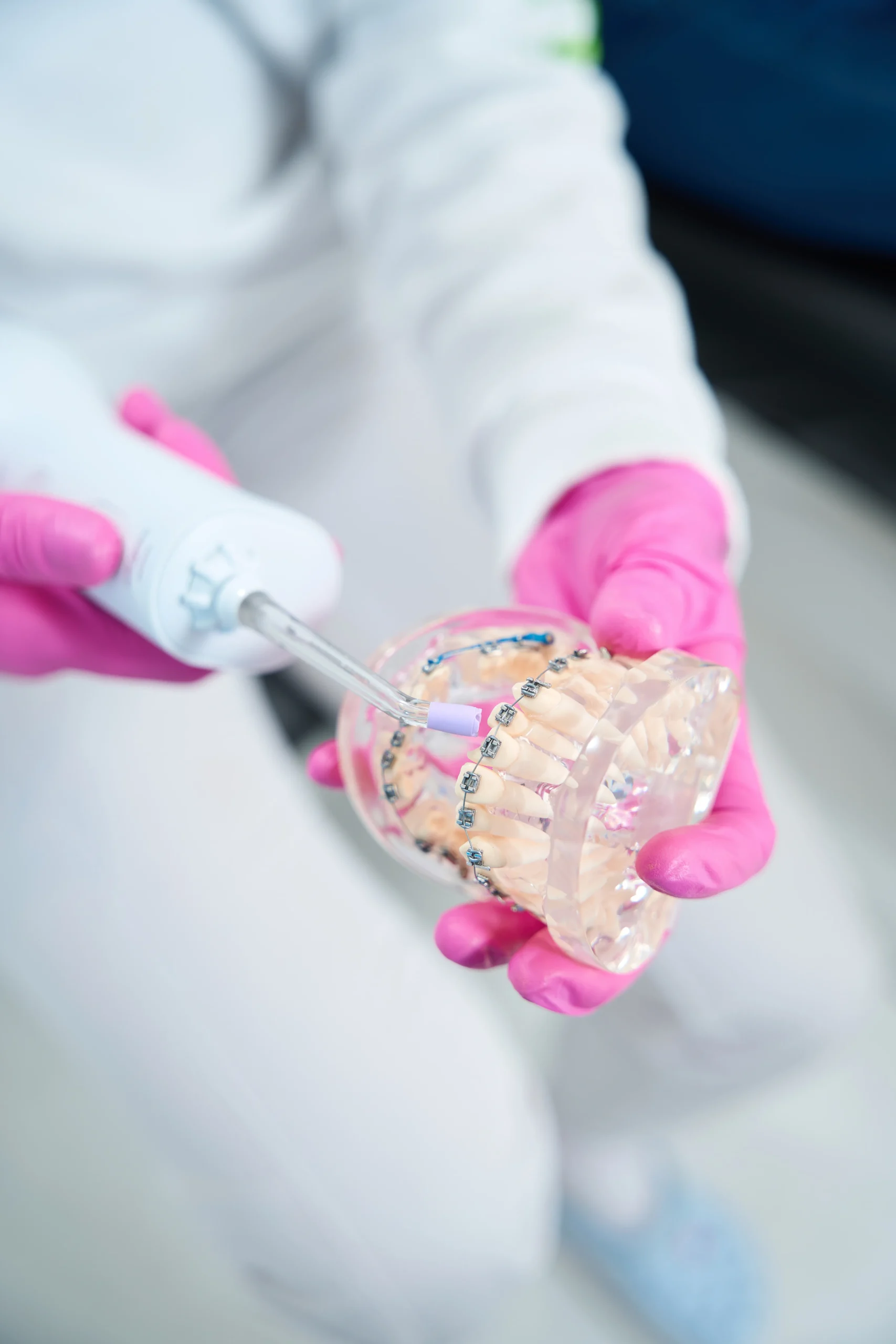 dentist-holds-in-his-hands-irrigator-and-model-den-2024-10-18-09-04-54-utc dentist-holds-in-his-hands-irrigator-and-model-den-2024-10-18-09-04-54-utc